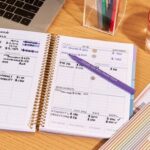 Budget planner with pen for no-spend month challenge