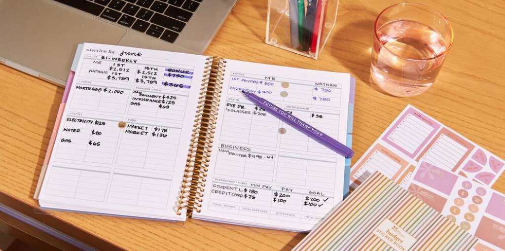 Budget planner with pen for no-spend month challenge